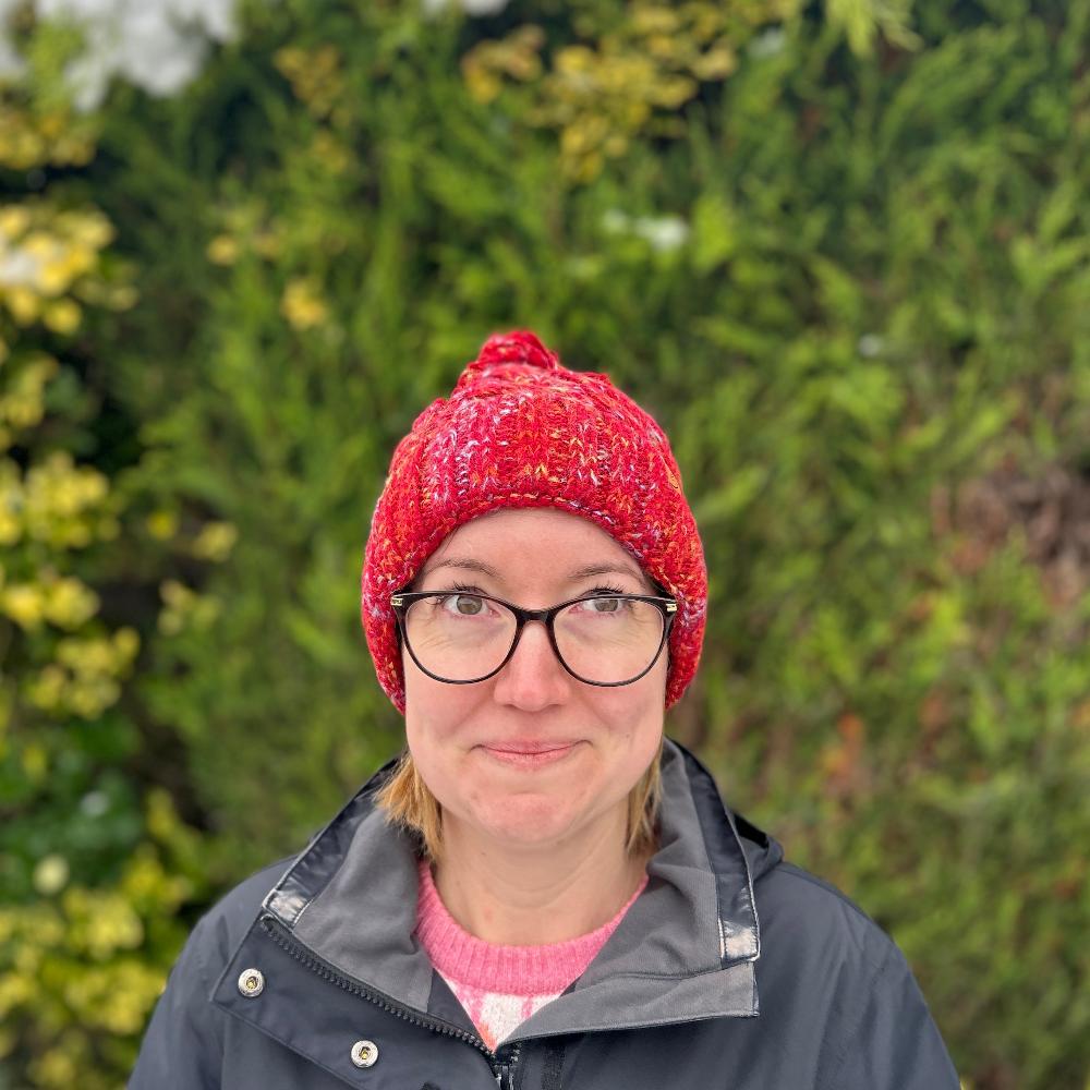 red woolly hat with fleece lining